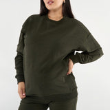 Made from our Cozy Fleece, an ultra-soft bamboo-cotton blend with a brushed interior, this pullover delivers warmth without bulk. Ribbed side panels provide extra stretch and ease, adapting comfortably through all stages of pregnancy and postpartum