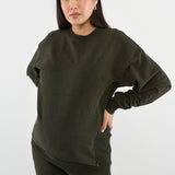 Made from our Cozy Fleece, an ultra-soft bamboo-cotton blend with a brushed interior, this pullover delivers warmth without bulk. Ribbed side panels provide extra stretch and ease, adapting comfortably through all stages of pregnancy and postpartum