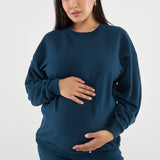 Made from our Cozy Fleece, an ultra-soft bamboo-cotton blend with a brushed interior, this pullover delivers warmth without bulk. Ribbed side panels provide extra stretch and ease, adapting comfortably through all stages of pregnancy and postpartum.