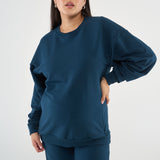 Made from our Cozy Fleece, an ultra-soft bamboo-cotton blend with a brushed interior, this pullover delivers warmth without bulk. Ribbed side panels provide extra stretch and ease, adapting comfortably through all stages of pregnancy and postpartum.