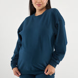 Made from our Cozy Fleece, an ultra-soft bamboo-cotton blend with a brushed interior, this pullover delivers warmth without bulk. Ribbed side panels provide extra stretch and ease, adapting comfortably through all stages of pregnancy and postpartum.