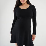 Above-the-knee maternity nursing dress with a fitted top, A-line skirt, and easy lift-up nursing access. Stylish, comfortable, and made in Canada.