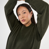 Made from our Cozy Fleece, an ultra-soft bamboo-cotton blend with a brushed interior, this pullover delivers warmth without bulk. Ribbed side panels provide extra stretch and ease, adapting comfortably through all stages of pregnancy and postpartum